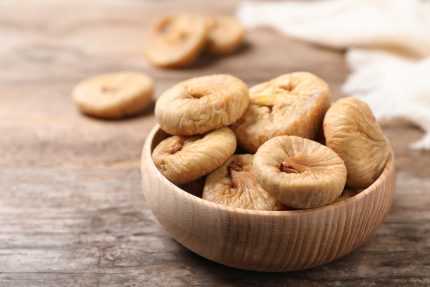 Tasty,Dried,Figs,In,Bowl,On,Wooden,Table