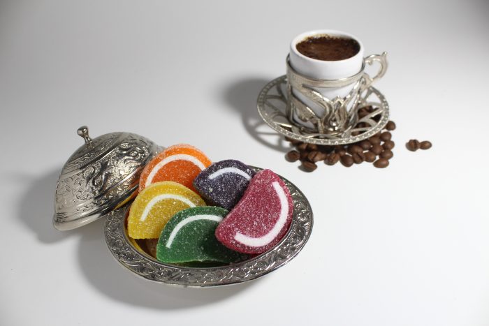 Candy,In,Silver,Bowl,With,Coffee,White,Background