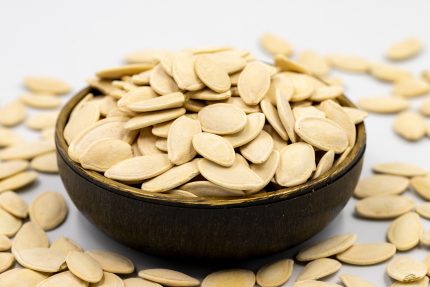 Shelled,Pumpkin,Seeds,On,A,White,Background.,Close-up.,Local,Name